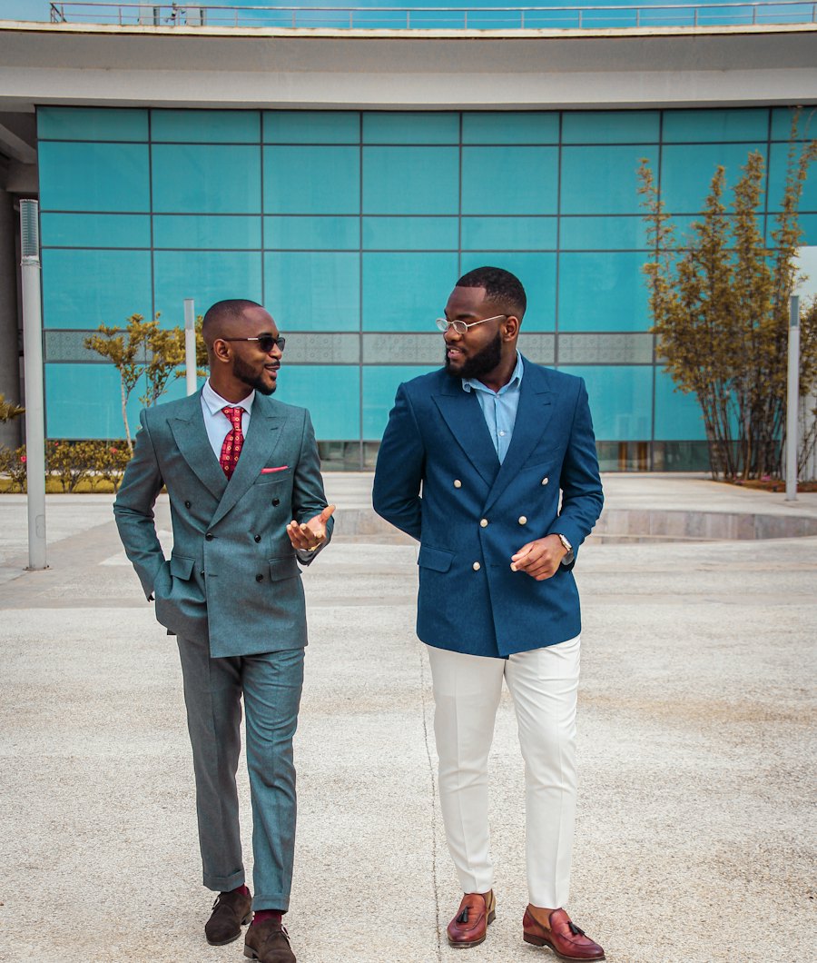 Two business professionals talking as they walk